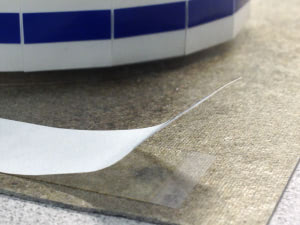 Tabbed die cut adhesive by Strouse