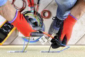 electrician_using_electrical_tape_on_wiring