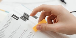 adhesive bonding attaches sticky note to book