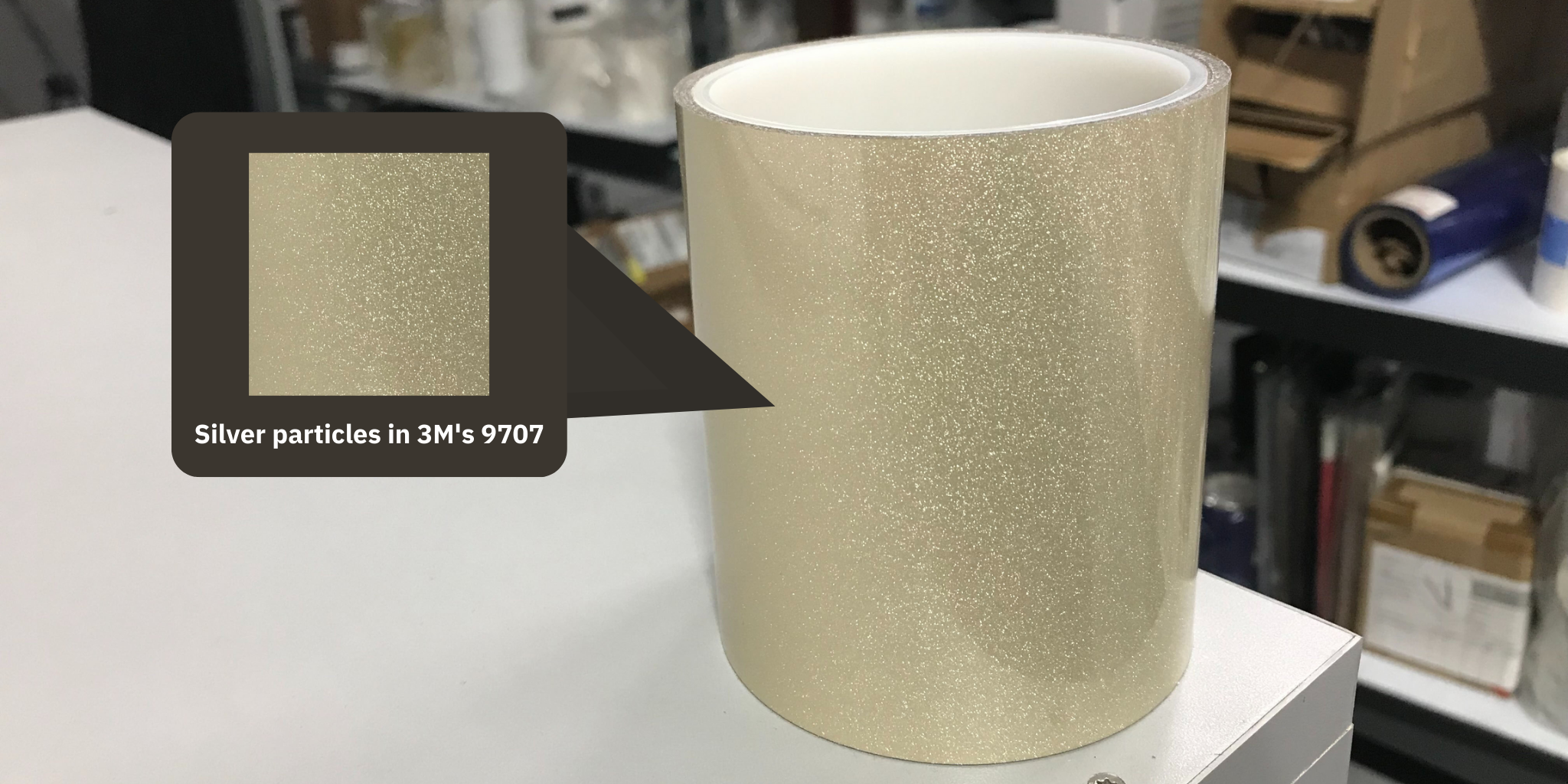 3M's electrically conductive adhesive transfer tape has tiny silver particles